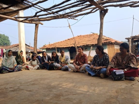 Health workers having a meeting with rural girls and women.
