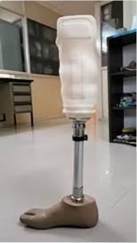 A prosthetic leg displayed standing on the floor