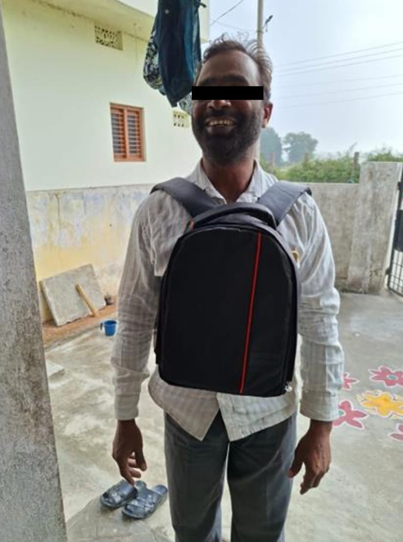 A man with a bag of healthcare kits
