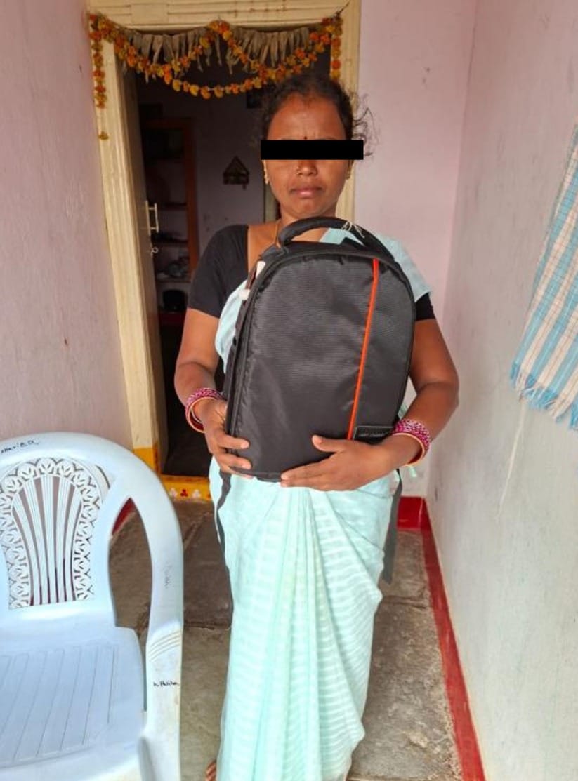 A lady with a bag of healthcare kits