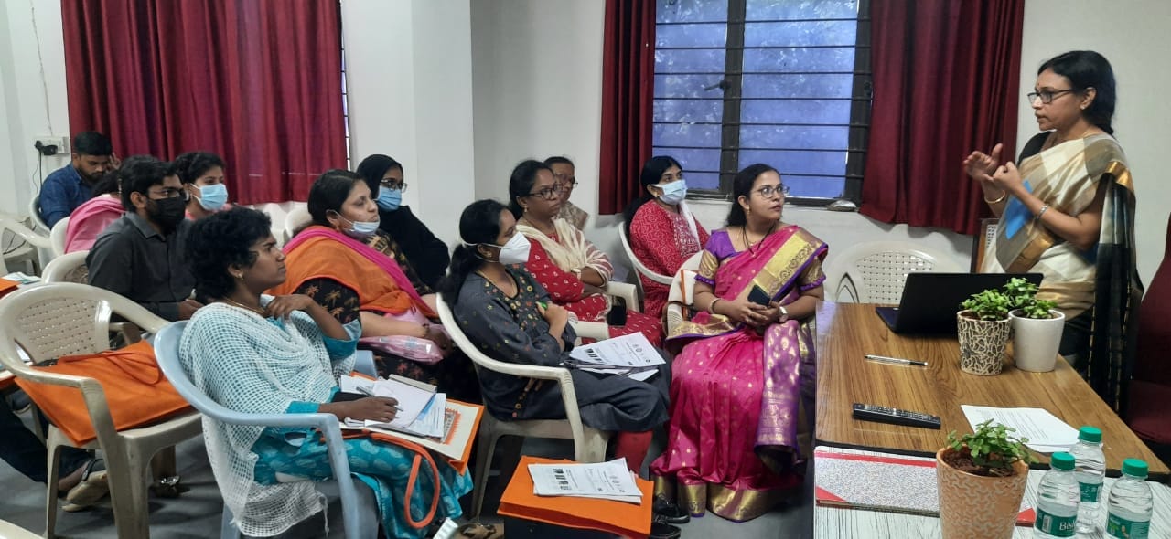A female health instructor teaching in the class