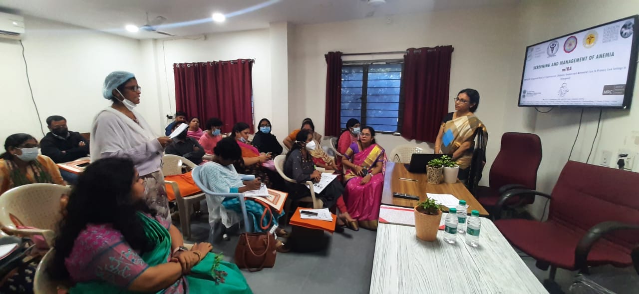 A female health instructor teaching in the class