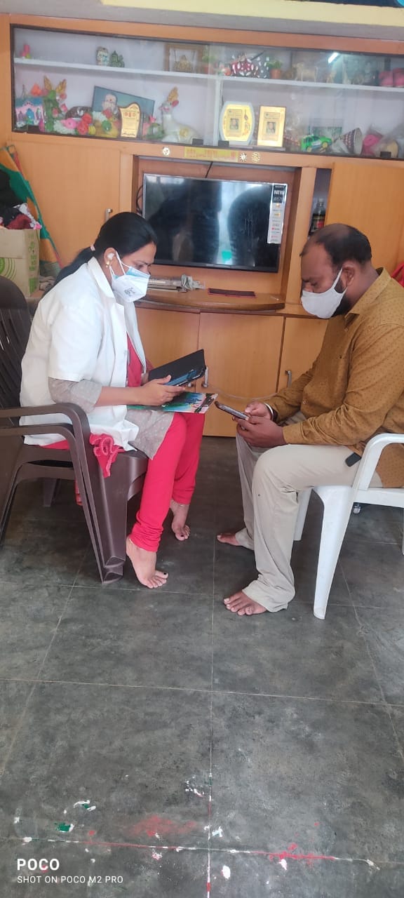 A health worker diagnosing a teenage man