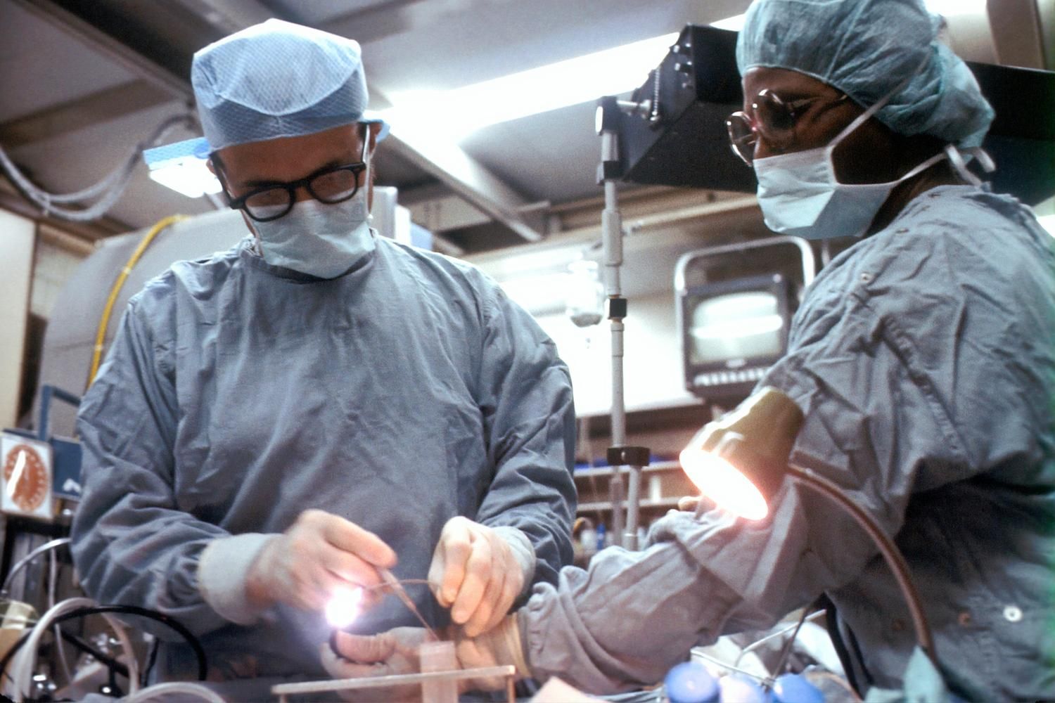 Surgeons performing a medical procedure in an operating room
